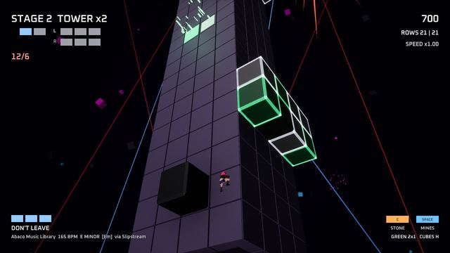 A black cube rolling down a neon tower